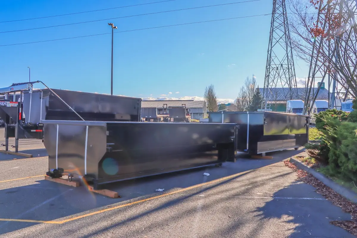 Roll-off dumpster ready for waste disposal at job site for 2 Yard Dumpster Rental in Bellmead
